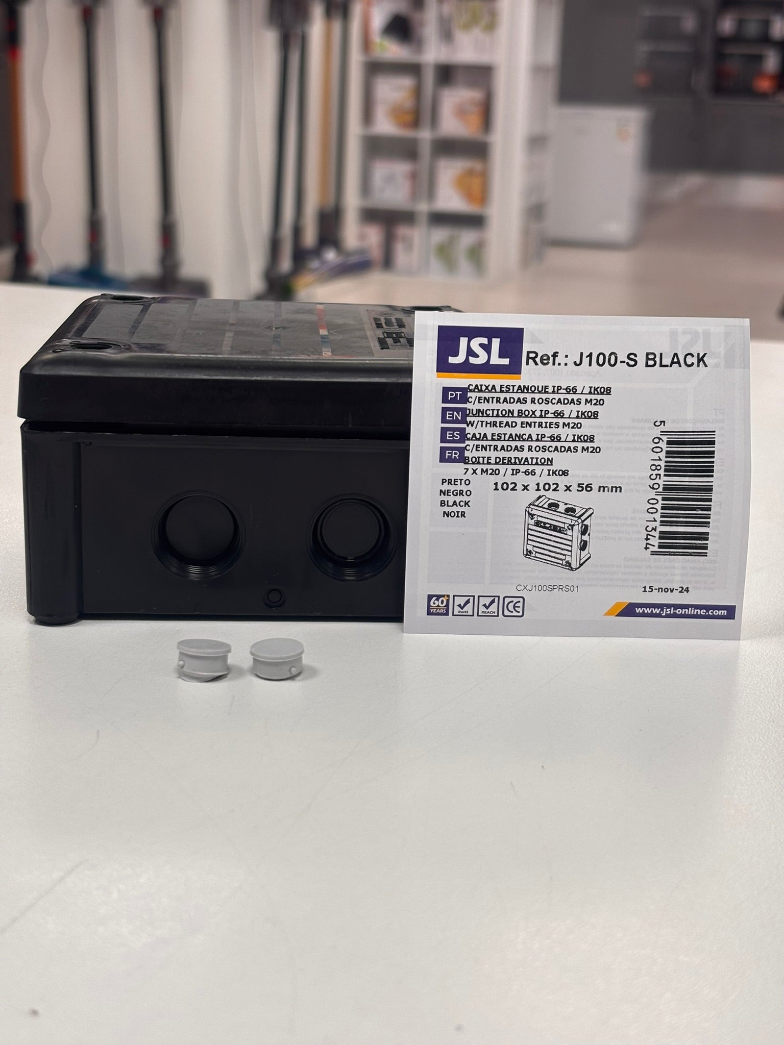 Black electronic device with a label on a white surface