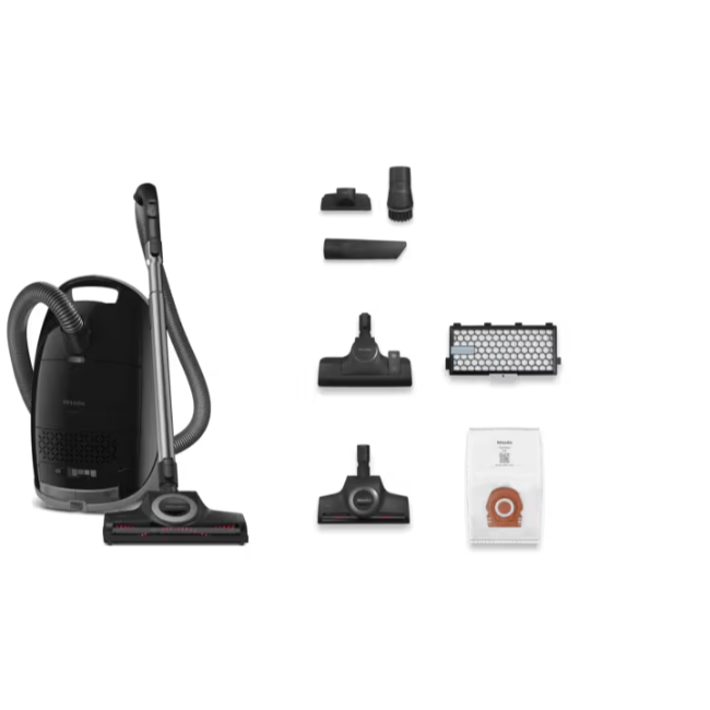 Black vacuum cleaner with various attachments on a white background