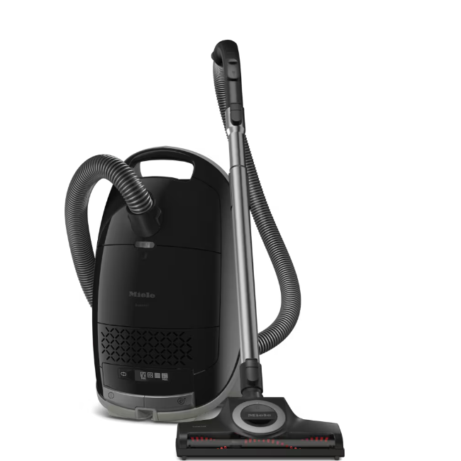 Black Miele vacuum cleaner on a white background