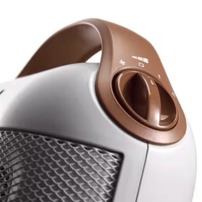 Close-up of a white and brown electric heater 