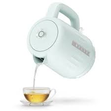Electric kettle pouring tea