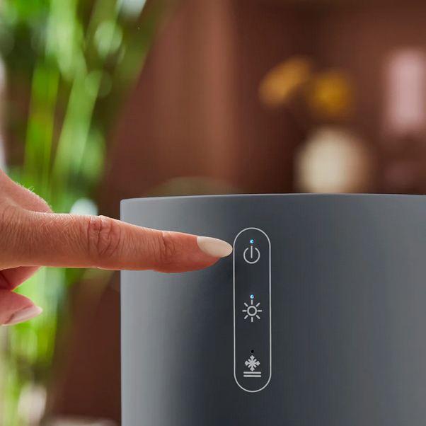 Hand pressing a control panel