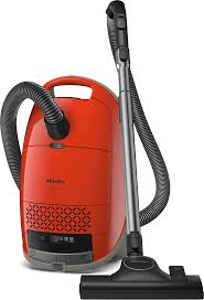 Red vacuum cleaner on a white background