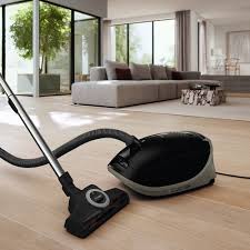 Vacuum cleaner on a wooden floor in a modern living room