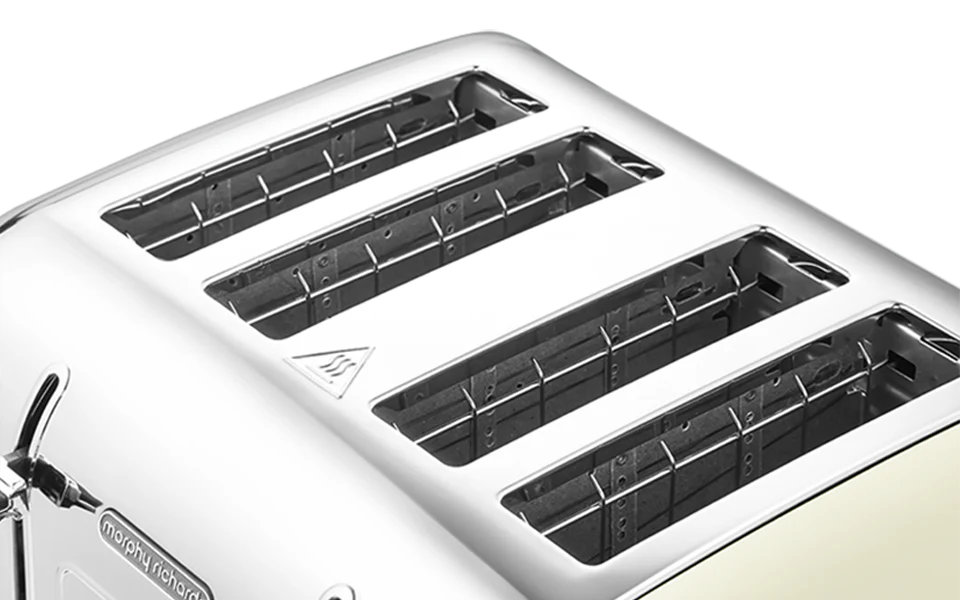 Close-up of a white toaster with four slots